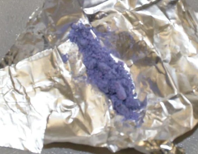 Brorphine or purple heroin powder on a piece of aluminum foil.