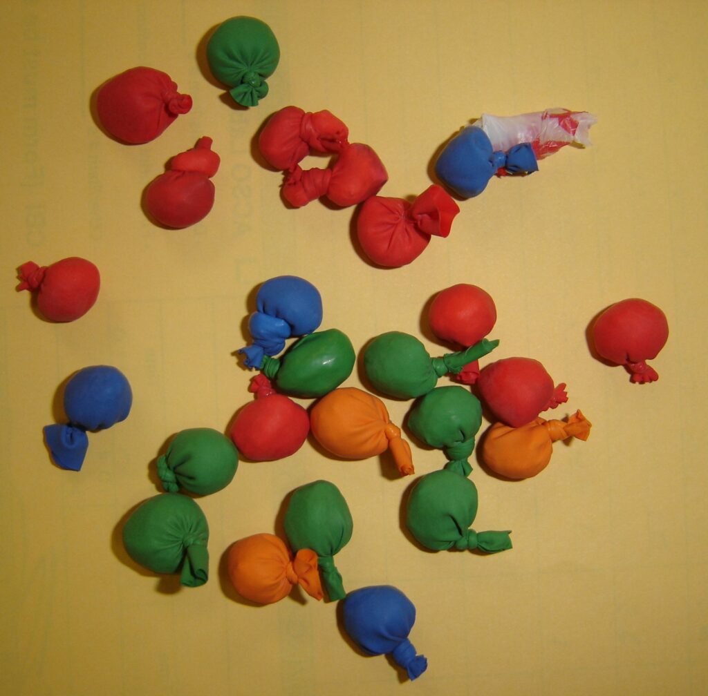 Heroin wrapped in small colored balloons.