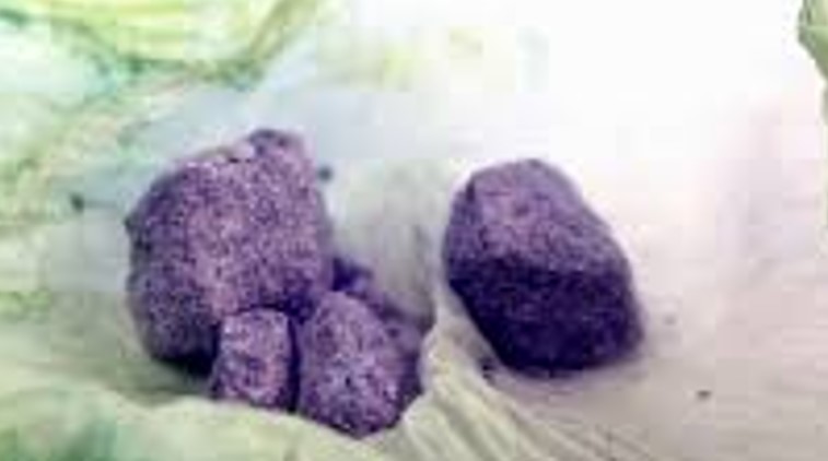 Image is of a purple rock like substance that is known as purple heroin.