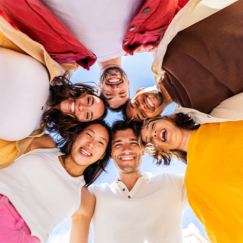 Happy group of young people in circle.