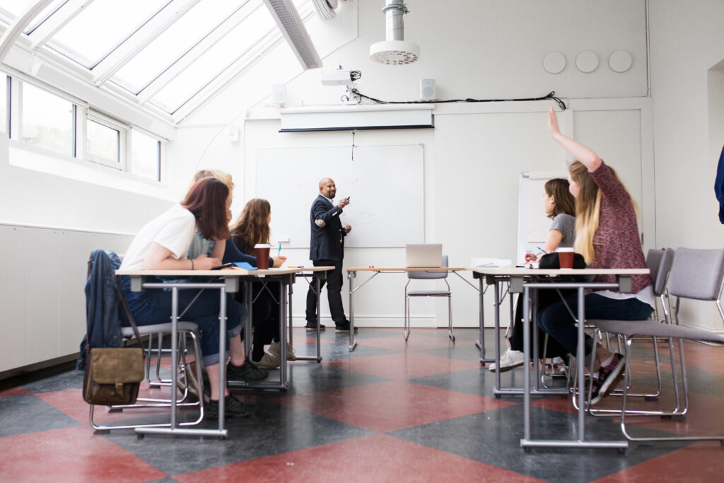 Students and teacher in a classroom.